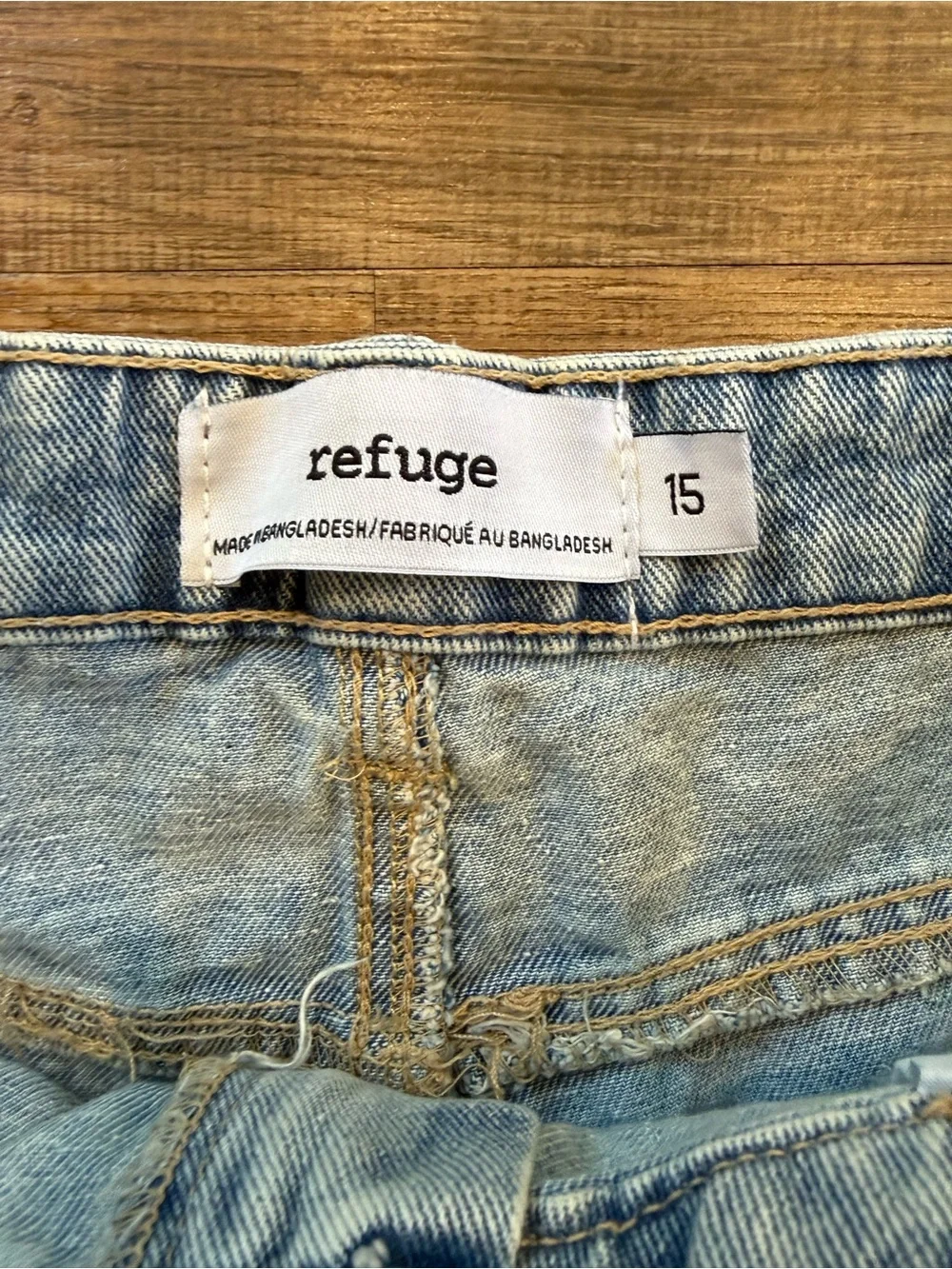 refuge light wash distressed denim cutoff shorts
